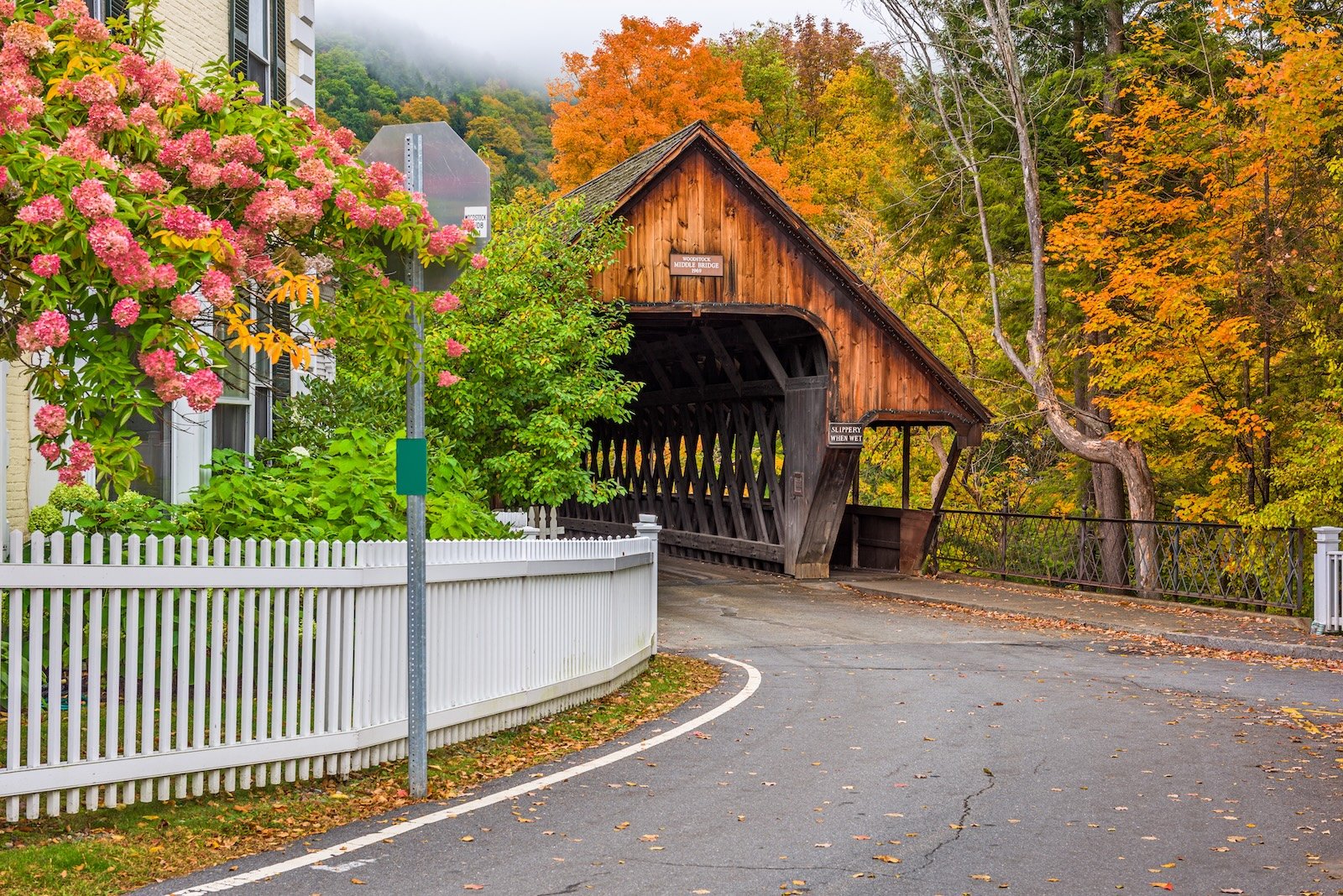 Middle Covered Bridge in Woodstock, Vermont, surrounded by colorful fall foliage